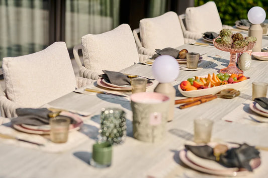 Fiave & Palermo Dining Collection with cushioned rope dining chairs around a styled outdoor table