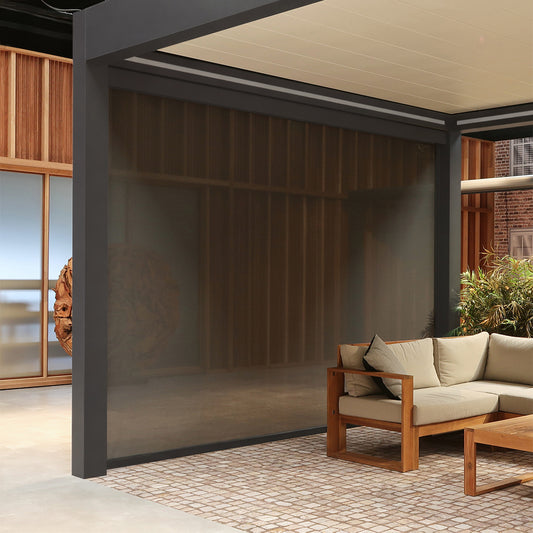 Retractable Pinela side screen providing privacy and shade beside a modern outdoor sofa.