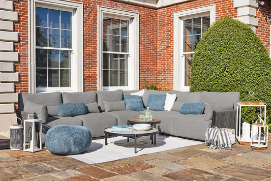 Sorrento outdoor lounge furniture set with modular seating and round lounge tables