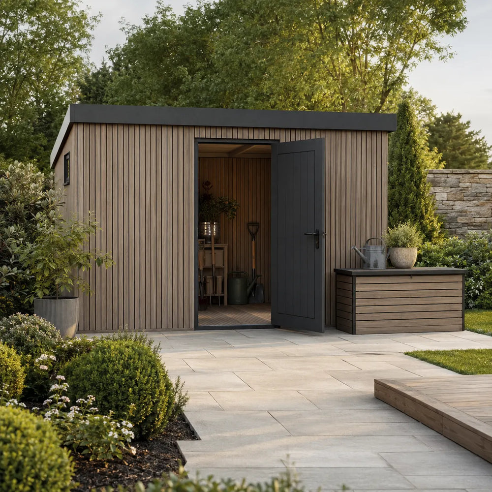 Contemporary timber garden shed with charcoal door and matching outdoor storage box in a landscaped garden – Verdant Lounge UK