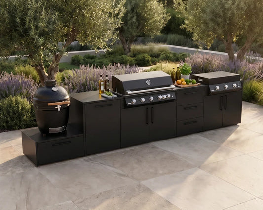 Verdant Lounge Feast Maker outdoor kitchen featuring a 120 cm gas grill, 100 cm plancha, Kamado Egg, black storage modules and Neolith stone worktop.