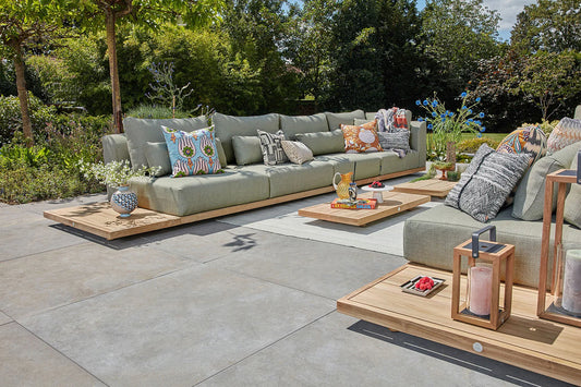 Aspen Lounge Collection modular outdoor seating with teak tables in a contemporary garden