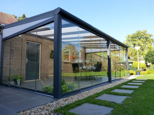Fiano sliding glass doors enclosing a modern garden veranda
