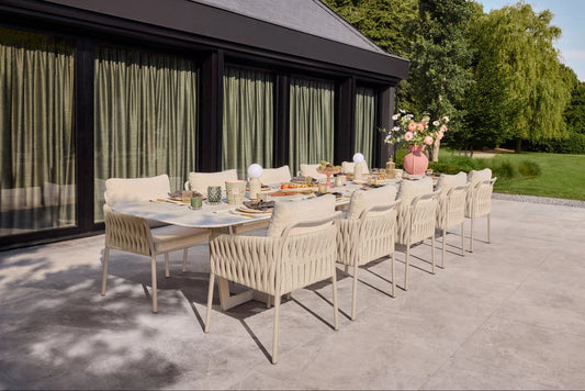 Fiave & Palermo Dining Collection with Camel Sand chairs and Palermo table in an outdoor dining setting